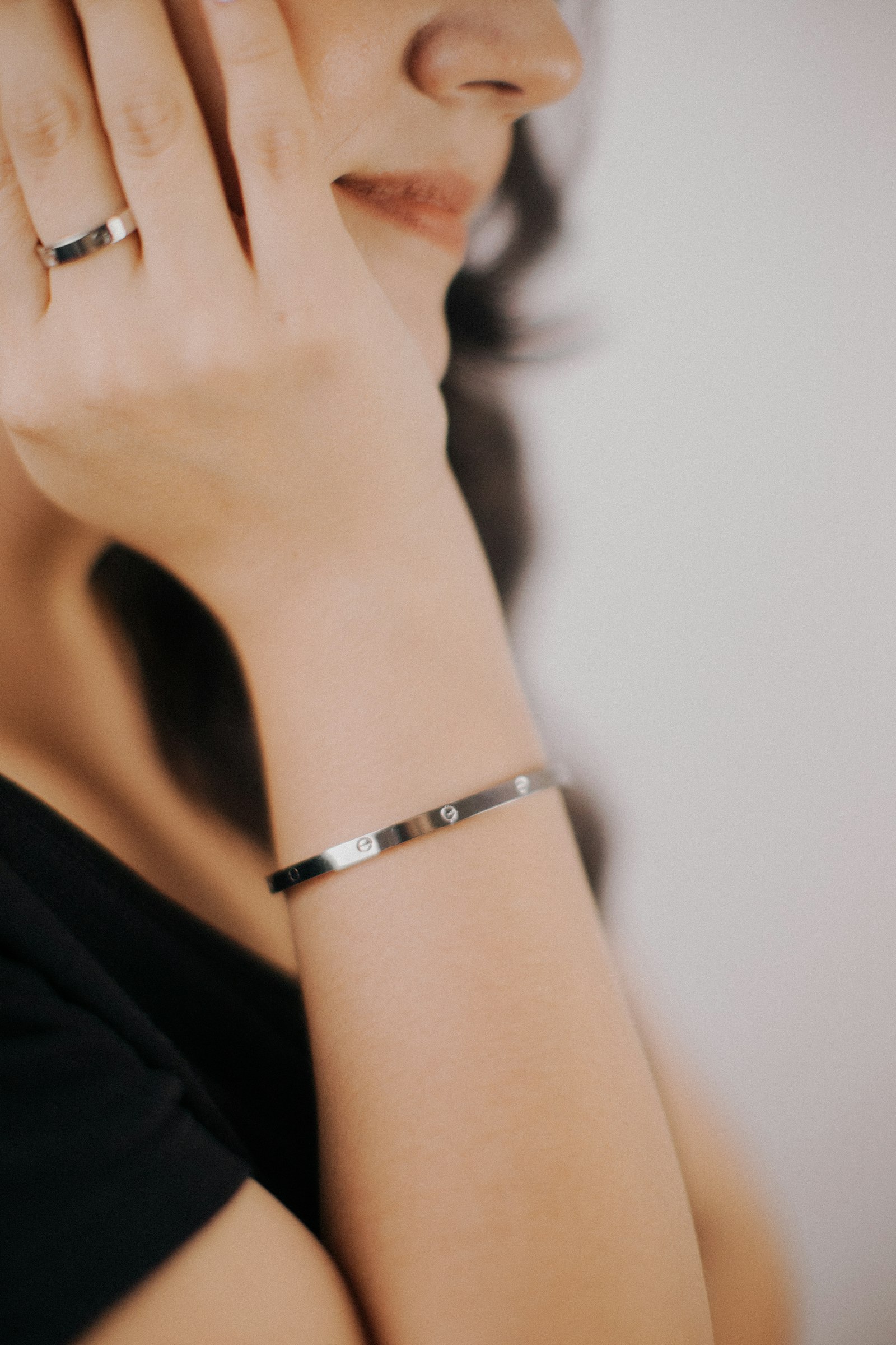 Silver bracelet worn on a woman's wrist